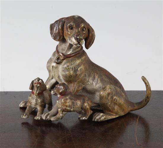 A late 19th century Austrian cold painted bronze group of a dog with two pups, H.3.25in.